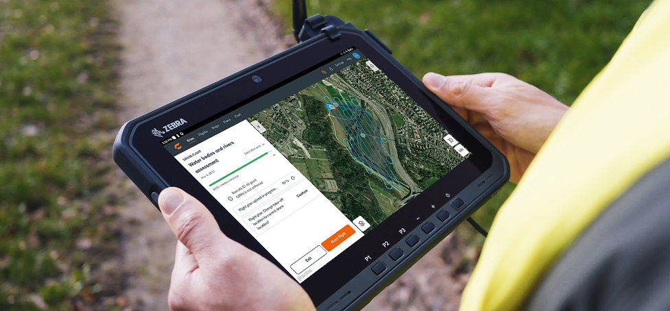 Surveyor on the field setting up a drone survey