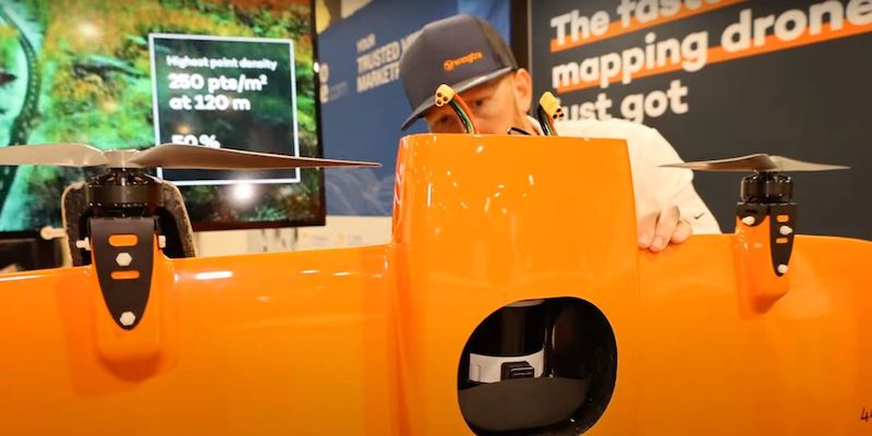 Wingtra employee inserting the Wingtra LIDAR into the WingtraOne Gen II at GeoWeek