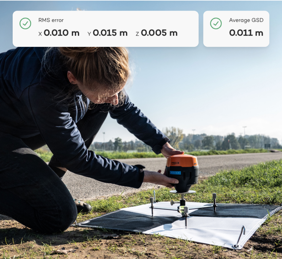 Surveyor setting up a base receiver to log GNSS data for a drone survey