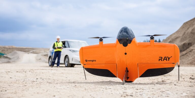 Drone in foreground surveyor in background