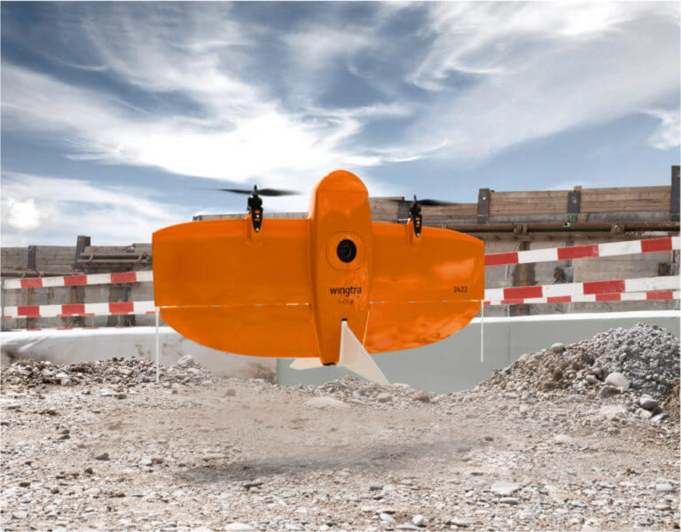 VTOL surveying drone landing on a construction site